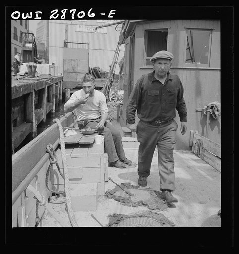 New York, New York. New England fisherman aboard their ship at Fulton fish market