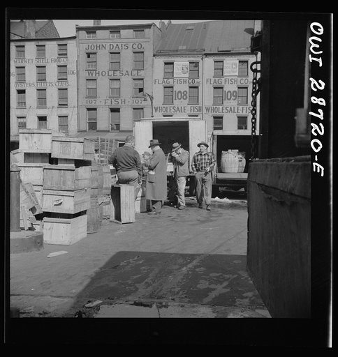 New York, New York. A buyer visits the wholesale district to purchase fish for his store