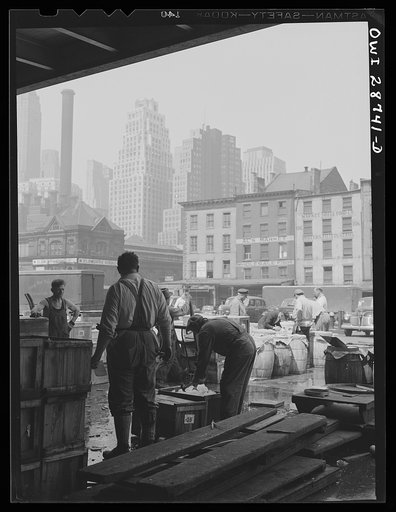 New York, New York. "Hookers" at the Fulton fish market checking barrels of fish to be sent to retailers by trucks and express