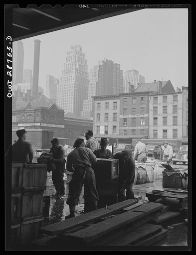 New York, New York. "Hookers" at the Fulton fish market checking barrels of fish to be sent to retailers by trucks and express
