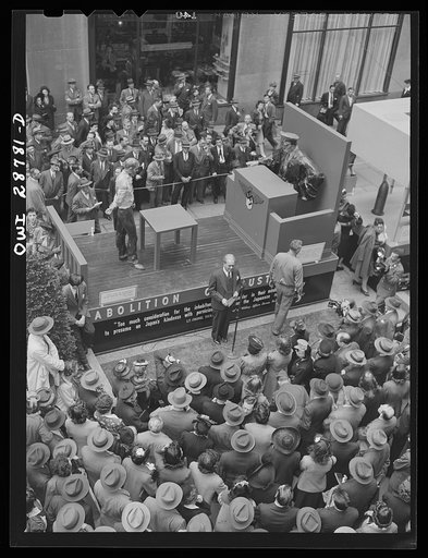 New York, New York. Exhibit at the outdoor exhibition entitled "The Nature of the Enemy," held on the plaza of Rockefeller Center. Speaker at the opening of the exhibit addressing a noonday audience