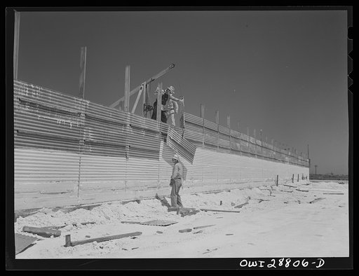 Freeport Sulphur Company, Hoskins Mound, Texas. Raising the walls on sulphur vat which is being built. Sulphur is put into these vats to a height of sixty feet. As it solidifies the sections of wall are raised