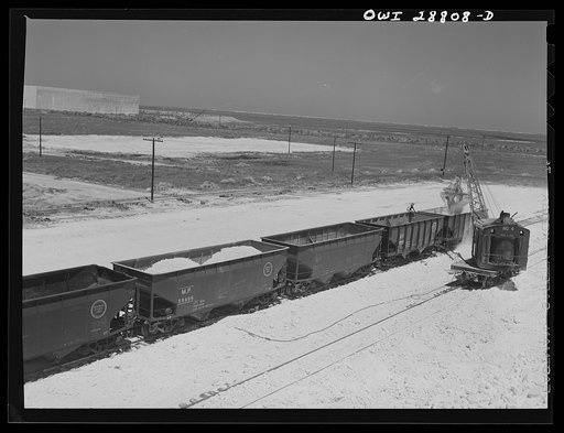Freeport Sulphur Company, Hoskins Mound, Texas. Loading railroad cars with sulphur
