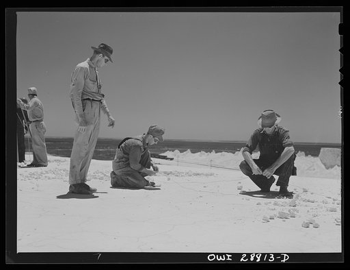 Freeport Sulphur Company, Hoskins Mound, Texas. Blasting crew preparing to blast the end of a sulphor vat