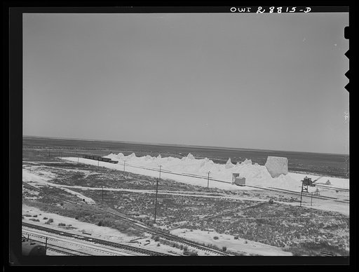 Untitled photo, possibly related to: Freeport Sulphur Company, Hoskins Mound, Texas. Sulphur vat from which trains are being loaded