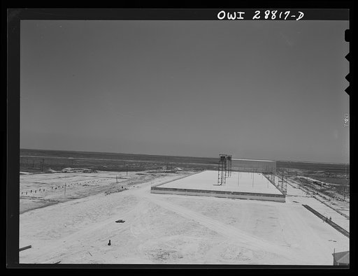 Freeport Sulphur Company, Hoskins Mound, Texas. Completed vat being filled with sulphur