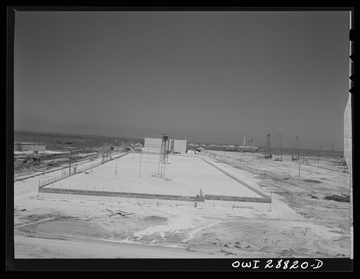 Untitled photo, possibly related to: Freeport Sulphur Company, Hoskins Mound, Texas. Completed vat being filled with sulphur
