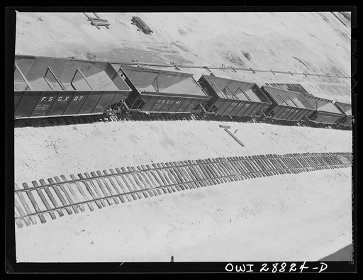 Freeport Sulphur Company, Hoskins Mound, Texas. Railroad cars at sulphur vat