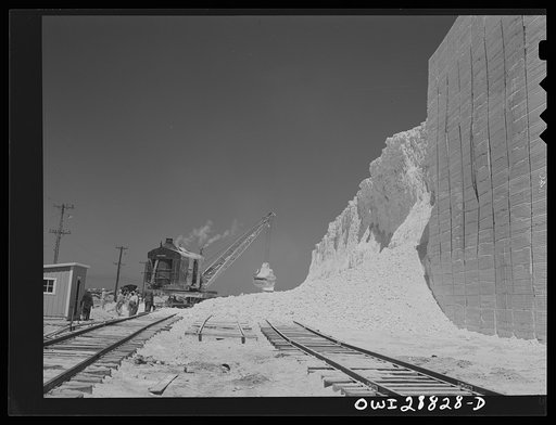 Freeport Sulphur Company, Hoskins Mound, Texas. Clearing sulphur off the railroad tracks after blasting