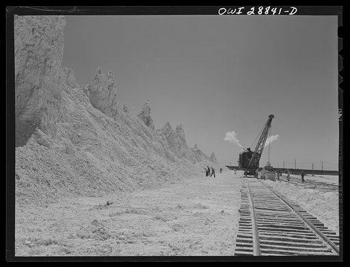 Untitled photo, possibly related to: Freeport Sulphur Company, Hoskins Mound, Texas. Sulphur vat from which boxcars are being loaded