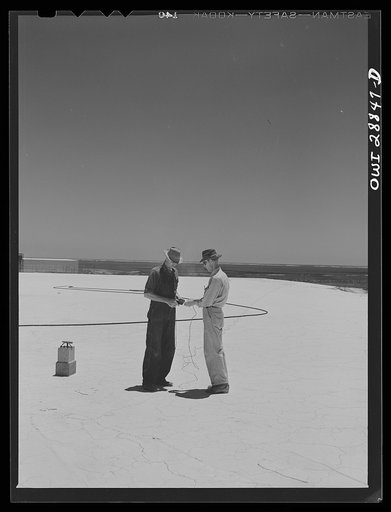 Freeport Sulphur Company, Hoskins Mound, Texas. Testing the wires preparatory to blasting from top of sulphur vat
