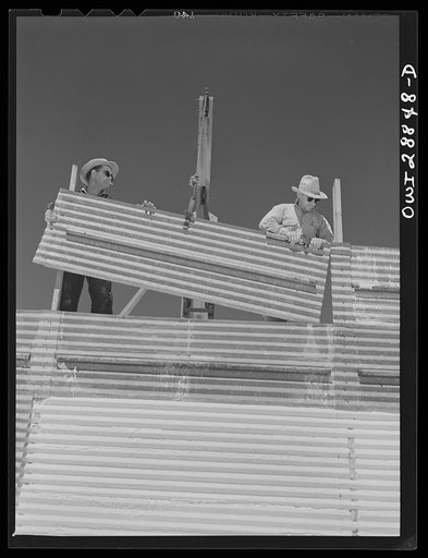 Freeport Sulphur Company, Hoskins Mound, Texas. Raising the walls on sulphur vat which is being built. Sulphur is put into these vats to a height of sixty feet. As it solidifies, the sections of wall are raised