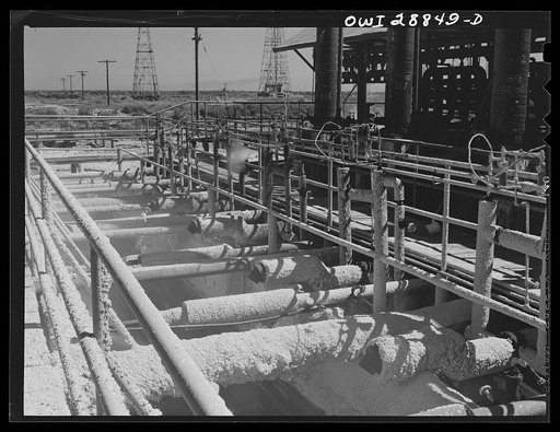 Untitled photo, possibly related to: Freeport Sulphur Company, Hoskins Mound, Texas. Molten sulphur pouring into a tank at relay station