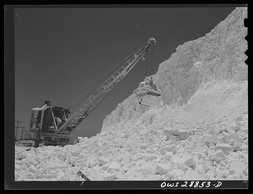 Freeport Sulphur Company, Hoskins Mound, Texas. Clearing sulphur off railroad tracks after blasting