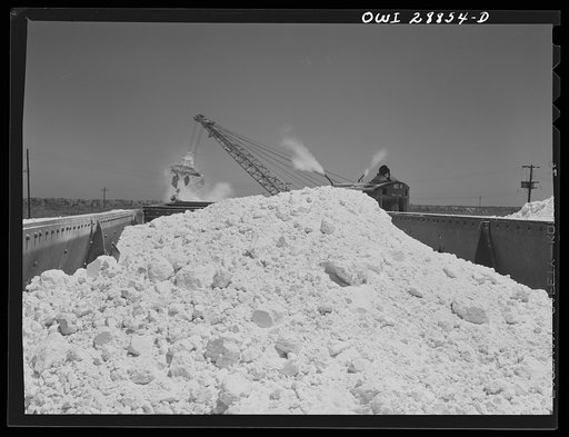 Untitled photo, possibly related to: Freeport Sulphur Company, Hoskins Mound, Texas. Clearing sulphur off railroad tracks after blasting