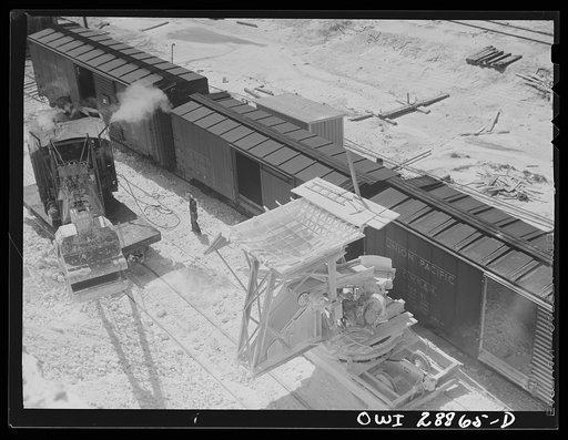 Freeport Sulphur Company, Hoskins Mound, Texas. Hopper with which boxcars are loaded with sulphur