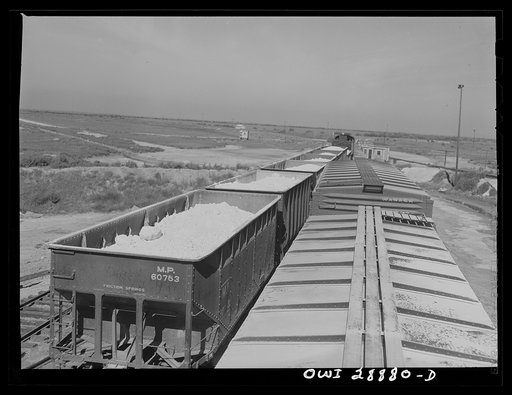 Untitled photo, possibly related to: Freeport Sulphur Company, Hoskins Mound, Texas. Open cars and boxcars loaded with sulphur