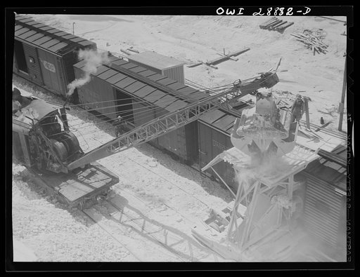 Untitled photo, possibly related to: Freeport Sulphur Company, Hoskins Mound, Texas. Hopper with which boxcars are loaded with sulphur