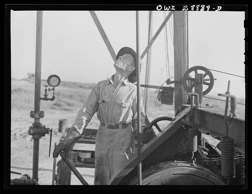 Freeport Sulphur Company, Hoskins Mound, Texas. A driller at a sulphur well