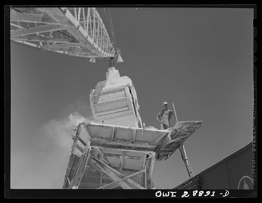 Freeport Sulphur Company, Hoskins Mound, Texas. Loading boxcars with sulphur