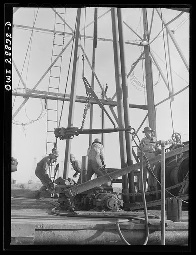 Freeport Sulphur Company, Hoskins Mound, Texas. Pulling up a pipe at a sulphur well