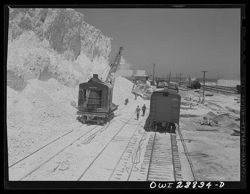 Freeport Sulphur Company, Hoskins Mound, Texas. Sulphur vat from which boxcars are being loaded