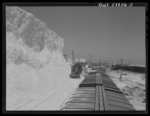 Untitled photo, possibly related to: Freeport Sulphur Compnay, Hoskins Mound, Texas. Loading boxcars with sulphur