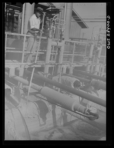 Freeport Sulphur Company, Hoskins Mound, Texas. Obtaining a sample of sulphur at a relay station