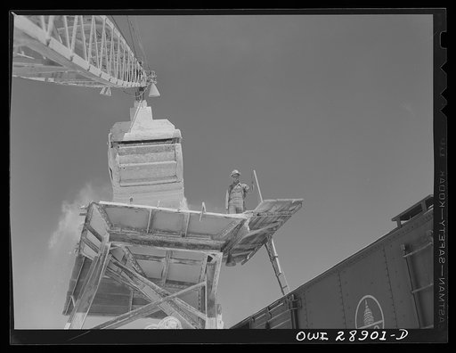 Untitled photo, possibly related to: Freeport Sulphur Company, Hoskins Mound, Texas. Loading boxcars with sulphur