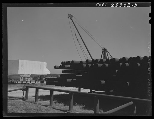 Untitled photo, possibly related to: Freeport Sulphur Company. Hoskins Mound, Texas. Pipe storage. Pipelines are laid for carrying superheated water to the wells and for carrying melted sulphur to relay stations and to the vats