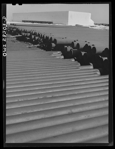 Untitled photo, possibly related to: Freeport Sulphur Company. Hoskins Mound, Texas. Pipe storage. Pipelines are laid for carrying superheated water to the wells and for carrying melted sulphur to relay stations and to the vats