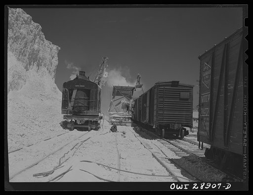 Freeport Sulphur Company, Hoskins Mound, Texas. Loading boxcars with sulphur