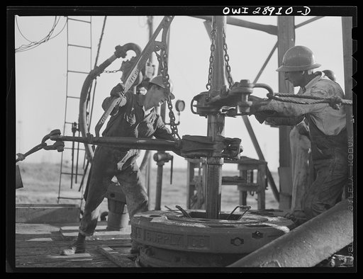 Untitled photo, possibly related to: Freeport Sulphur Company, Hoskins Mound, Texas. Pulling up a pipe at a sulphur well