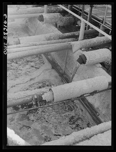 Freeport Sulphur Company, Hoskins Mound, Texas. Molten sulphur pouring into a tank at relay station