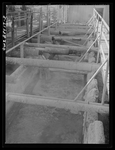 Freeport Sulphur Company, Hoskins Mound, Texas. Molten sulphur pouring into a tank at relay station