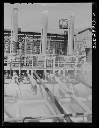 Freeport Sulphur Company, Hoskins Mound, Texas. Molten sulphur pouring into a tank at a relay station