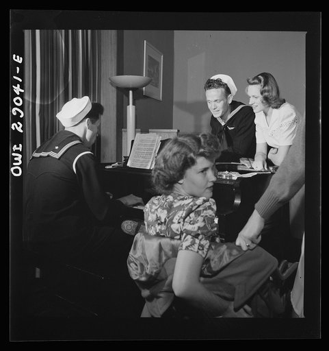 Arlington, Virginia. A group around a piano in the lounge of Idaho Hall, Arlington Farms, a residence for women who work in the United States government for the duration of the war
