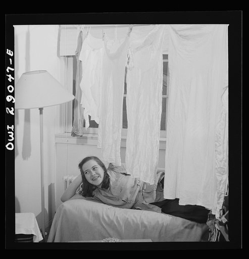 Arlington, Virginia. A common scene in a room at Idaho Hall, Arlington Farms, a residence for women who work in the United States government for the duration of the war. There is a shortage of space in the laundries, therefore the rooms are usually festooned with clothes. Authorities say that hangin