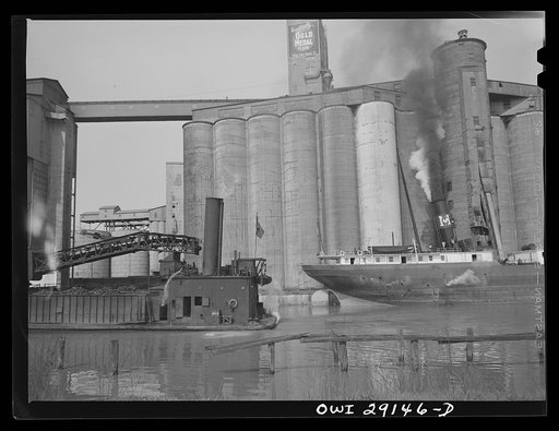Buffalo, New York. Grain elevators and coal barge