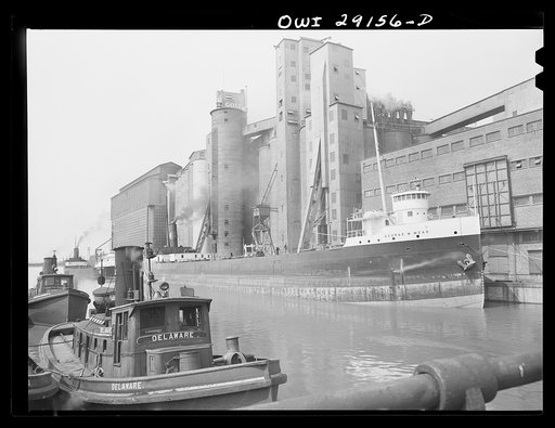 Buffalo, New York. Tugboats, grain boats, and grain elevators on the Erie Canal