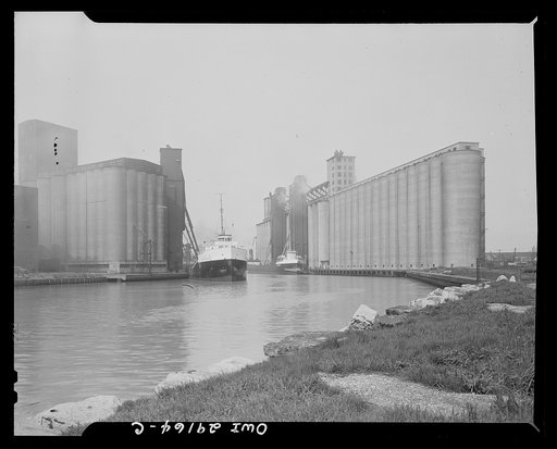 Buffalo, New York. Grain boats and grain elevators on the Erie Canal
