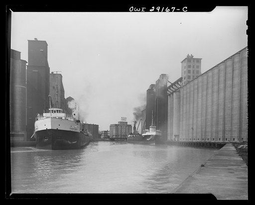 Buffalo, New York. Grain boats and grain elevators on the Erie Canal