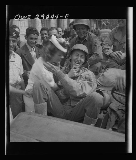 Porto Farina, Tunisia. Girl kissing a United States Army war correspondent