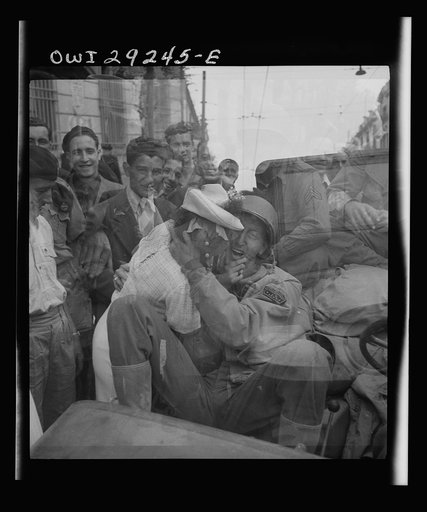 Untitled photo, possibly related to: Porto Farina, Tunisia. Girl kissing a United States Army war correspondent