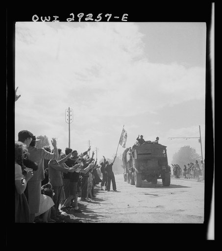 Tunis, Tunisia. People waving the tricolor as the Allies enter the city
