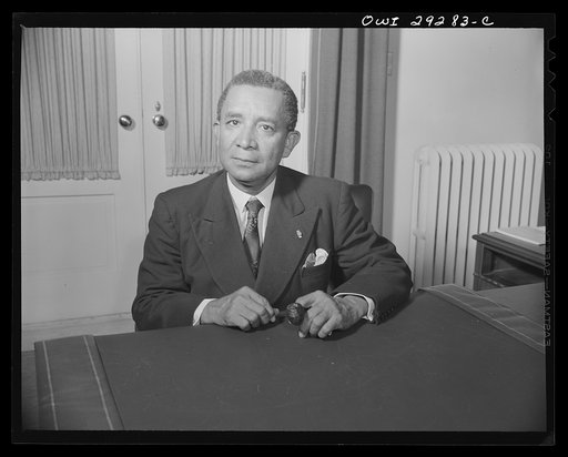 Untitled photo, possibly related to: Washington, D.C. Edwin Barclay, President of the Republic of Liberia, is shown at a desk in historic Blair House following a press conference at the United States State Department