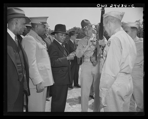 Liberian Presidential party visits Fort Belvoir. Two twenty-one gun salutes, a regimental review and a luncheon with the commanding officers were tendered His Excellency, Edwin Barclay, President of the Republic of Liberia, when he visited Fort Belvoir, Virginia, on May 29, 1943. An officer demonstr
