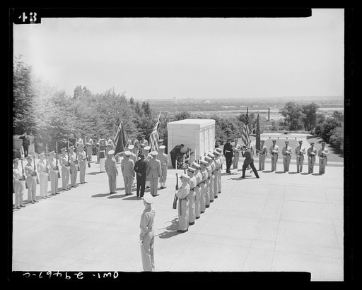 Untitled photo, possibly related to: His Excellency, Edwin Barclay, President of the Republic of Liberia, paid homage to the Unknown Soldier on a visit to Arlington National Cemetery Saturday, May 29th. Shown here is the ceremony as President Barclay places a wreath on the Tomb of the Unknown Soldie