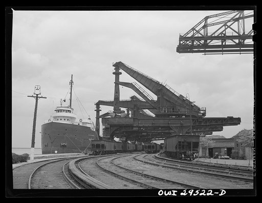 Cleveland, Ohio. Unloading a lake freighter by means of Hewlett [i.e., Hulett] unloaders at the Pennsylvania Railroad iron ore docks