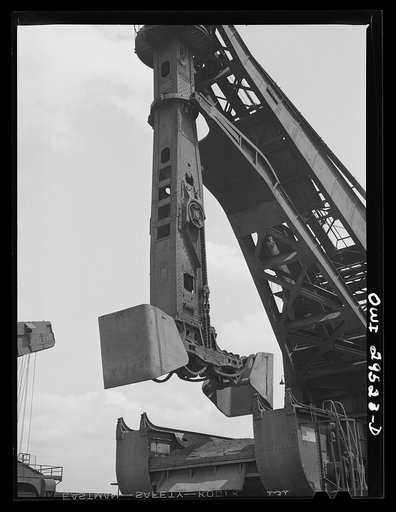 Cleveland, Ohio. Unloading a lake freighter by means of Hewlett [i.e., Hulett] unloaders at the Pennsylvania Railroad iron ore docks